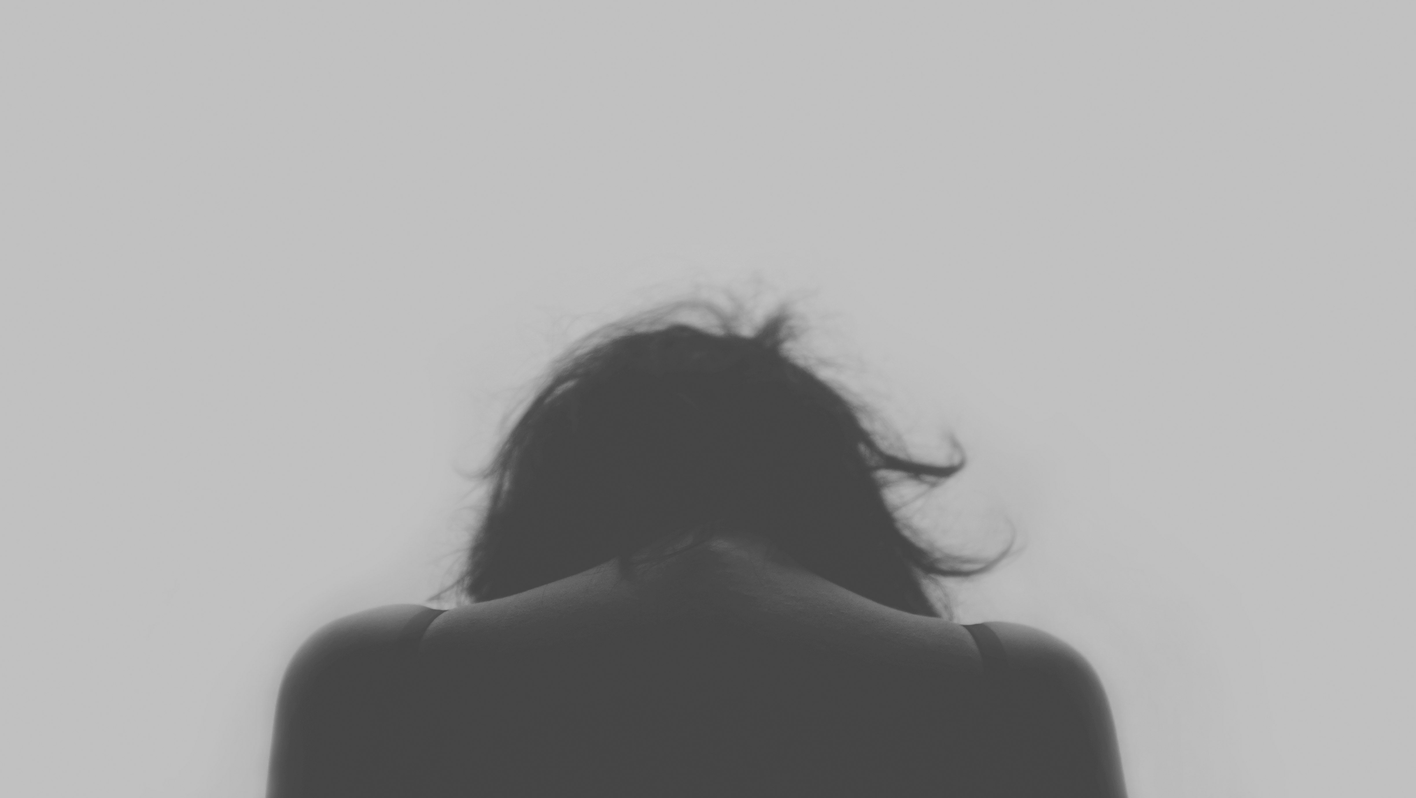 grayscale photo of person's back